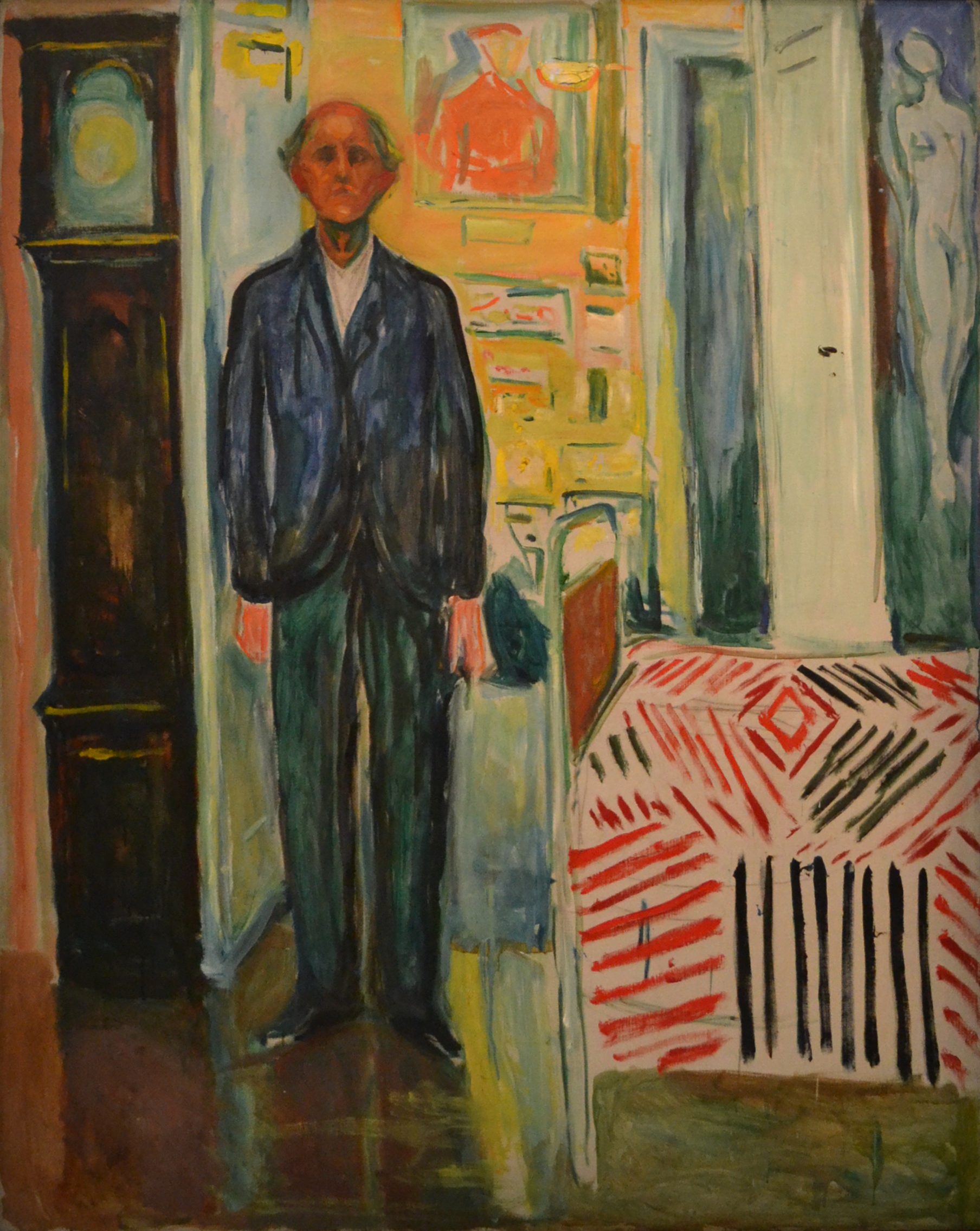 Edvard Munch: Self-Portrait. Between the Clock and the Bed. Oil on canvas, 1940-43. Photo © Munchmuseet